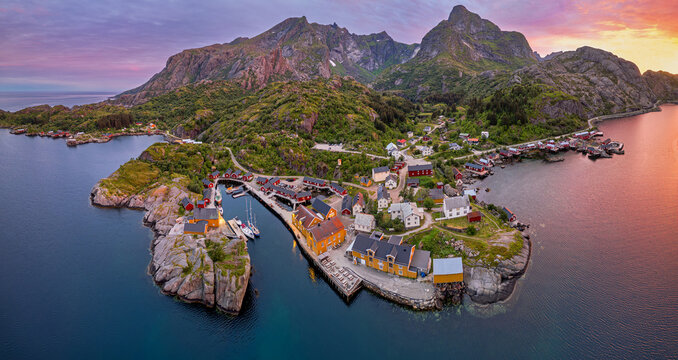 Fishing village Nusfjord at midnight sun - aerial overview (Lofoten, Norway)
