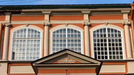 A magnificent building with arched windows and elegant columns