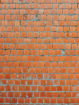 Orange clay building blocks pattern as design element