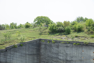 The Fertőr&aacute;kosi Quarry in Hungary presents an impressive view with its towering stone walls and central walkway that guides visitors through this historic limestone extraction site.