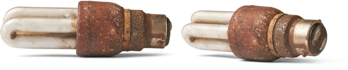 old dirty and rusty cfl light bulb isolated white background, accumulated dirt, dust and debris...