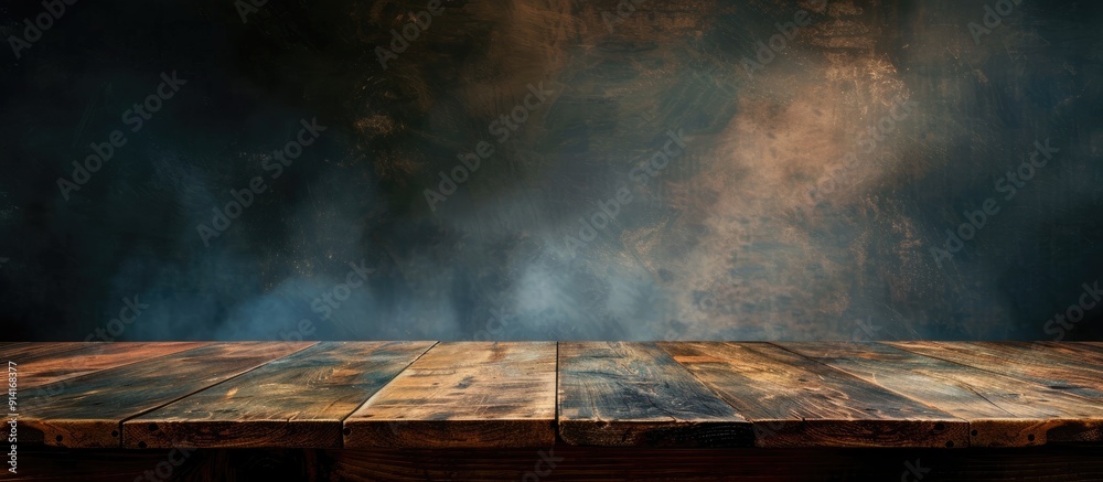 Leinwandbilder Wooden table with a dark hazy backdrop ideal for web backgrounds on vintage promotional materials to spotlight items with copy space image