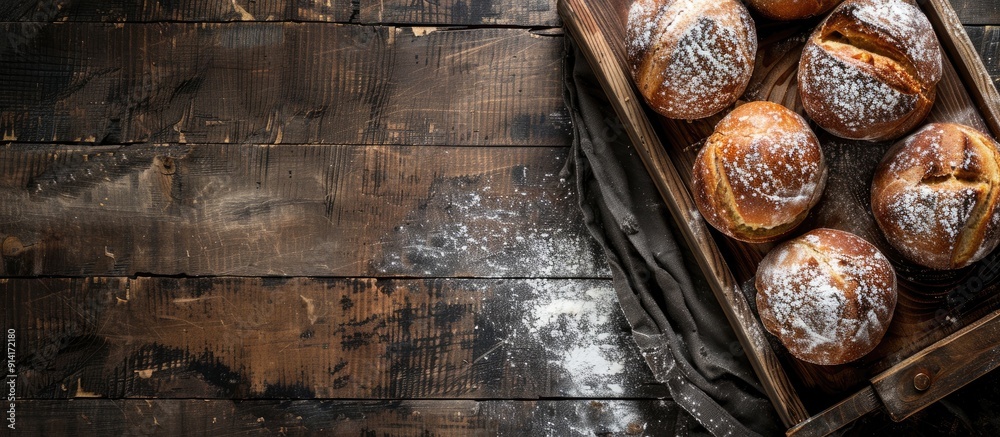 Poster Top down view of a wooden tray in a bakery setting with ample copy space image