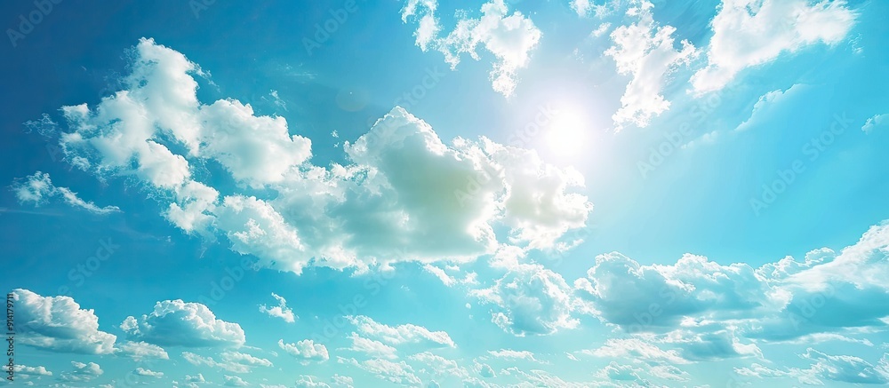 Wall mural Scenic blue sky with fluffy clouds ideal for a copy space image