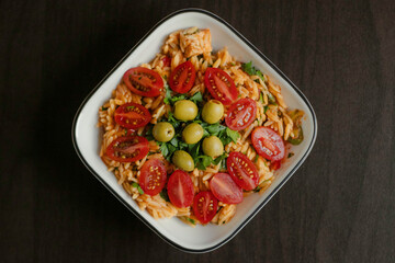 Pasta with tomatoes, olives, and herbs