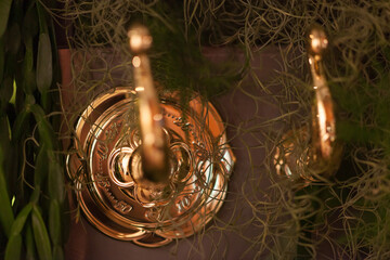 Close up on fairy garden water taps popping out of garden leaves. 