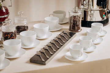 Coffee or tea cups on catering table at conference or wedding banquet table