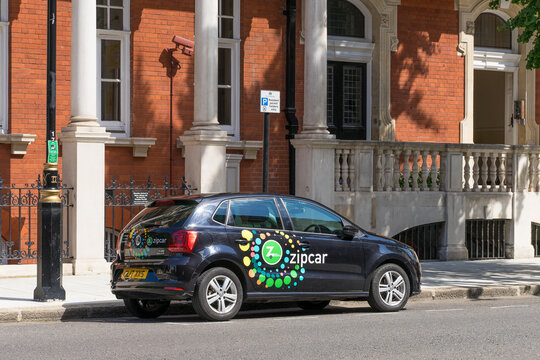 A Zipcar parked at the side of a road in Kensington. A car sharing vehicle with the companies logo on the side. London - 11th August 2021