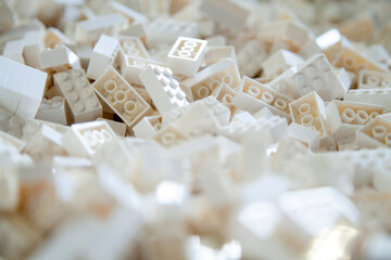 A pile of colorful interlocking building white blocks typically used as children&rsquo;s educational and developmental toys.