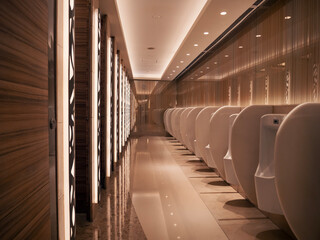 Modern public restroom with sleek white urinals and elegant lighting at night