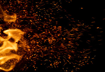 fire flame with sparks on black background.