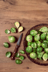 fresh Brussels sprouts, raw, top view, on a wooden table, no people,