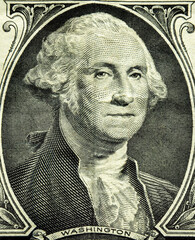 A macro shot capturing the elaborate engravings around the number one on a United States dollar bill. George Washington. 