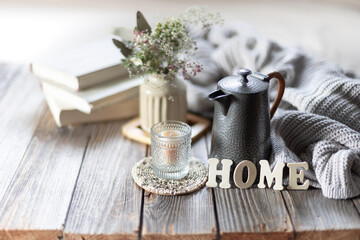 Cozy composition with the inscription home. Home coziness and comfort