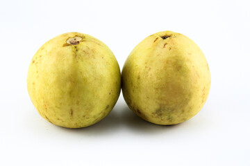 two ripe red guavas on a white isolated background