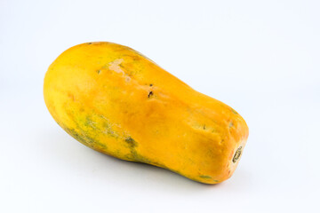 Ripe papaya fruit with a fresh looking light orange color on a white isolated background