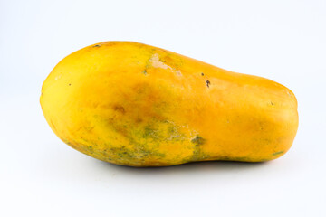 Ripe papaya fruit with a fresh looking light orange color on a white isolated background