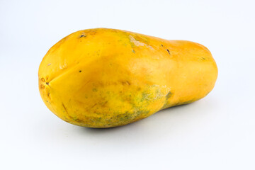 Ripe papaya fruit with a fresh looking light orange color on a white isolated background