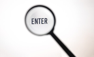 Word enter on screen through magnifying glass close-up