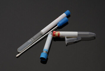 Test tubes on a black background close up