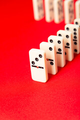 Domino effect ready to begin. Acrylic pieces in a row.