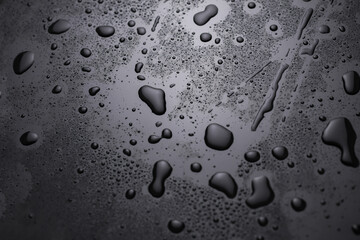 Drops of water on a black surface
