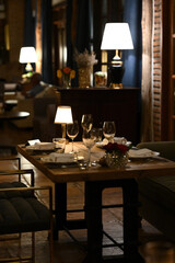 Elegant Evening Dining, A cozy dinner setting with warm lighting creates an intimate atmosphere for a romantic evening