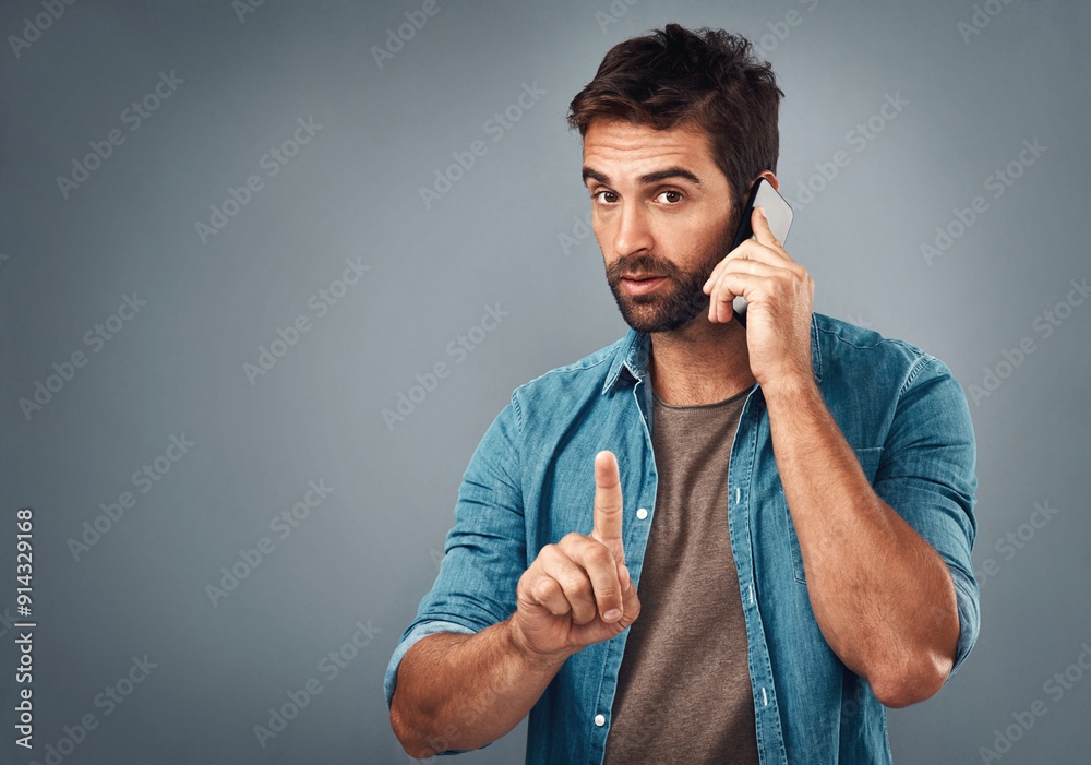 Poster man, phone call and finger for quiet in studio portrait, talk and emoji for privacy in conversation.