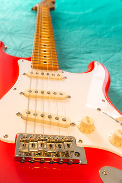 Fiesta Red Squire Stratocaster guitar on a bleu background. S&atilde;o Paulo, Brazil, Juli 27, 2024.