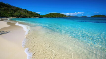 Pristine White Sand Beach With Crystal Clear Waters and Lush Green Hills in the Caribbean
