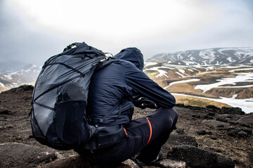 Hiker walking in the mountains in Iceland.