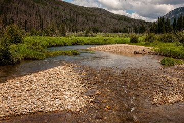 The headwaters of the Colorado River in the Kawuneeche Valley, Rocky Mountain National Park, Colorado in mid-July
