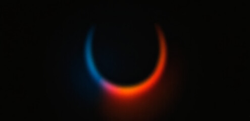 A vibrant abstract gradient background featuring a glowing light effect in blue, orange, and red hues against a dark backdrop.
