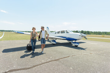 couple walking outside an aircraft