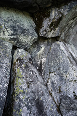 Close-up view of gray rocks with patches of moss