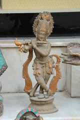 Bronze figurine of Krishna playing the flute.