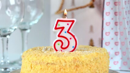 Celebration cake with burning candle number 3, video 4k resolution