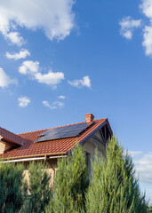 House with Solar Panels and Blue Sky