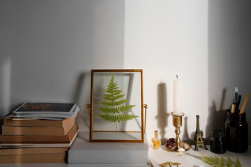 Vintage aesthetic studying and college desk background with books and pressed flower, cottagecore and light academia