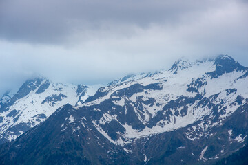 Landscape of valley with fog in the austrian village Bramberg near the mountain Wildkogel