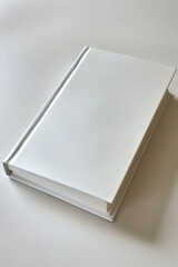 Hyperrealistic Image of a Closed White Notebook on a Minimalist White Background Captured in Photorealism 
