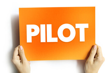 Pilot - a person who operates the flying controls of an aircraft, text concept on card