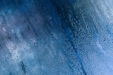 drops on the wet glass of the window.