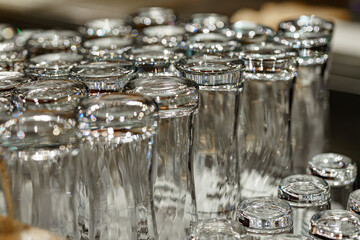 Empty draft beer glasses at a bar.