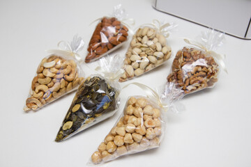 nuts in gift packaging, almonds, cashews, hazelnuts, in transparent packaging