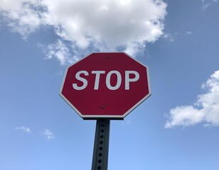 Obraz premium stop sign on blue sky with clouds create with ai