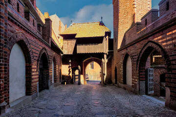 Fototapeta premium Malbork, Poland - the photo shows a fragment of the Teutonic Knights' castle, dedicated to the Blessed Virgin Mary. The castle was built in several stages from 1280 to the mid-15th century.