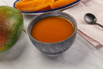 Sweet mango puree in the bowl