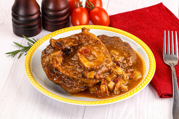 Italian cuisine - ossobuco with sauce