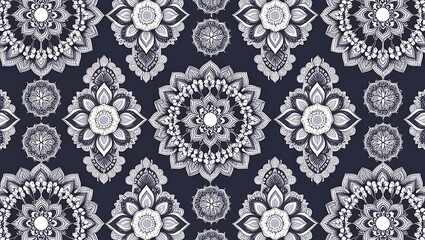 A seamless pattern featuring intricate white floral designs on a dark navy blue background